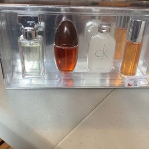 Brand new mens Calvin Klein Cologne set of 4 small bottles of 15 Ml each